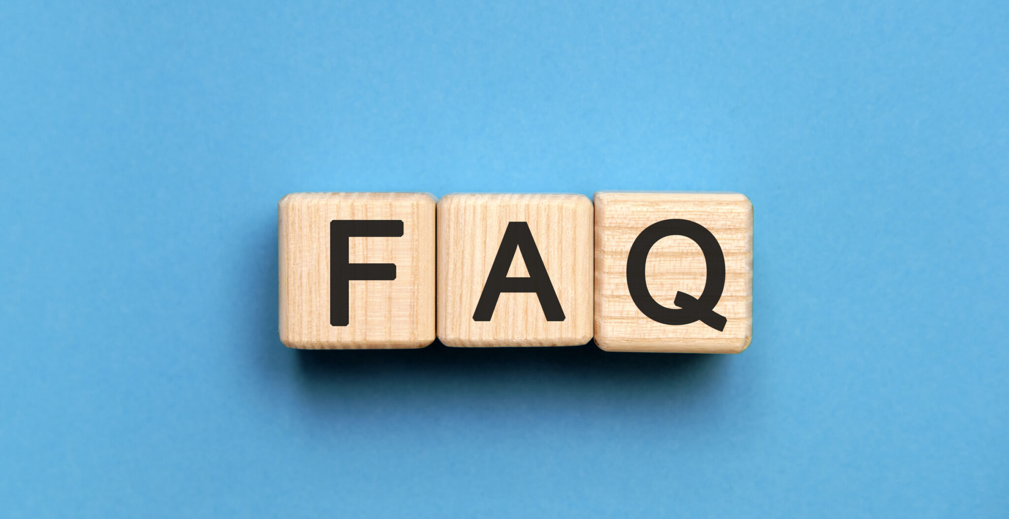 FAQ - text on wooden cubes, on wooden background, Plumbing Contractor.