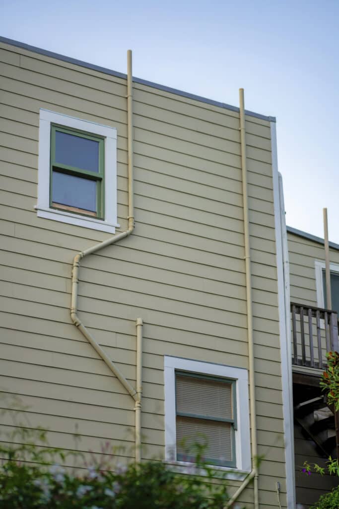 How solar heat islands in OKC neighborhoods warp your siding and pipe layout.