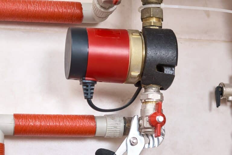 Recirc pump retrofit in Edmond speeds hot water to distant taps.